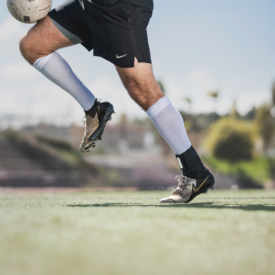Athlete doing drills wearing an ankle brace