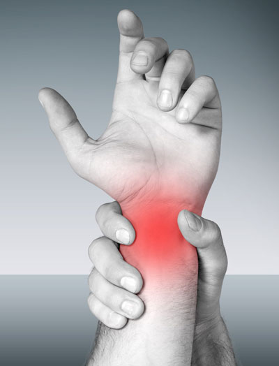 athlete holding their wrist in pain