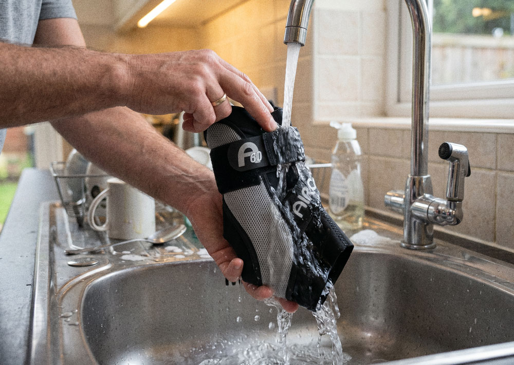 Aircast A60 Ankle Brace being washed in a kitchen sink