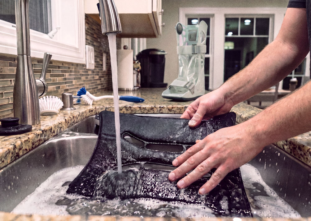 Aircast AirSelect Elite being washed in the kitchen sink