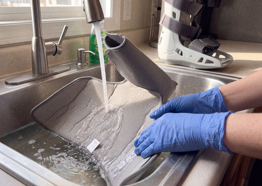 Aircast AirSelect Standard being washed in the kitchen sink