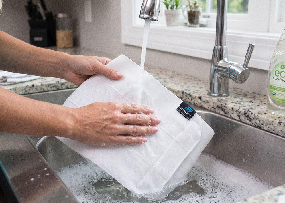 DonJoy Advantage Abdominal Support being washed in a kitchen sink