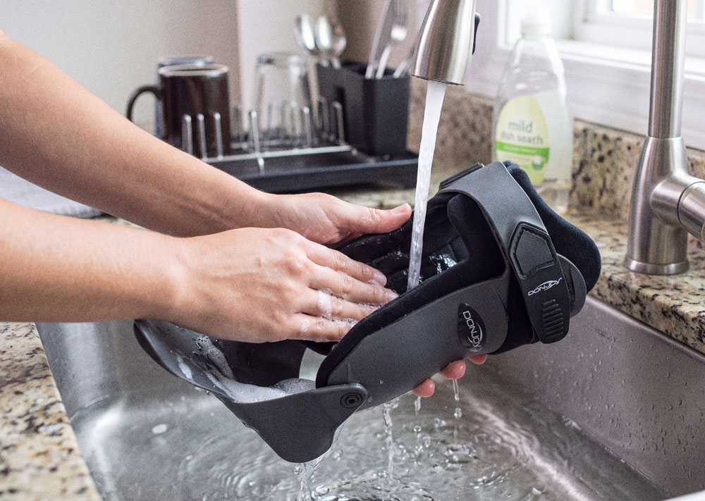DonJoy Velocity Ankle Brace being washed in the kitchen sink