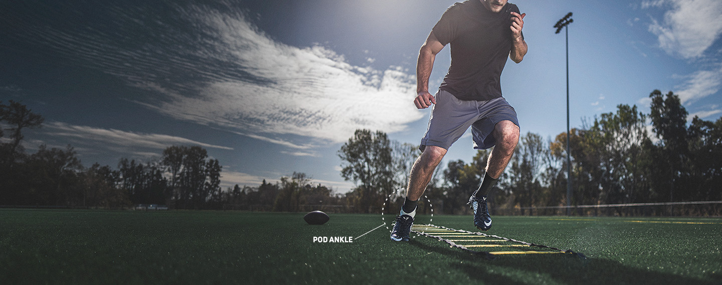 Athlete wearing the POD ankle brace doing football training drills