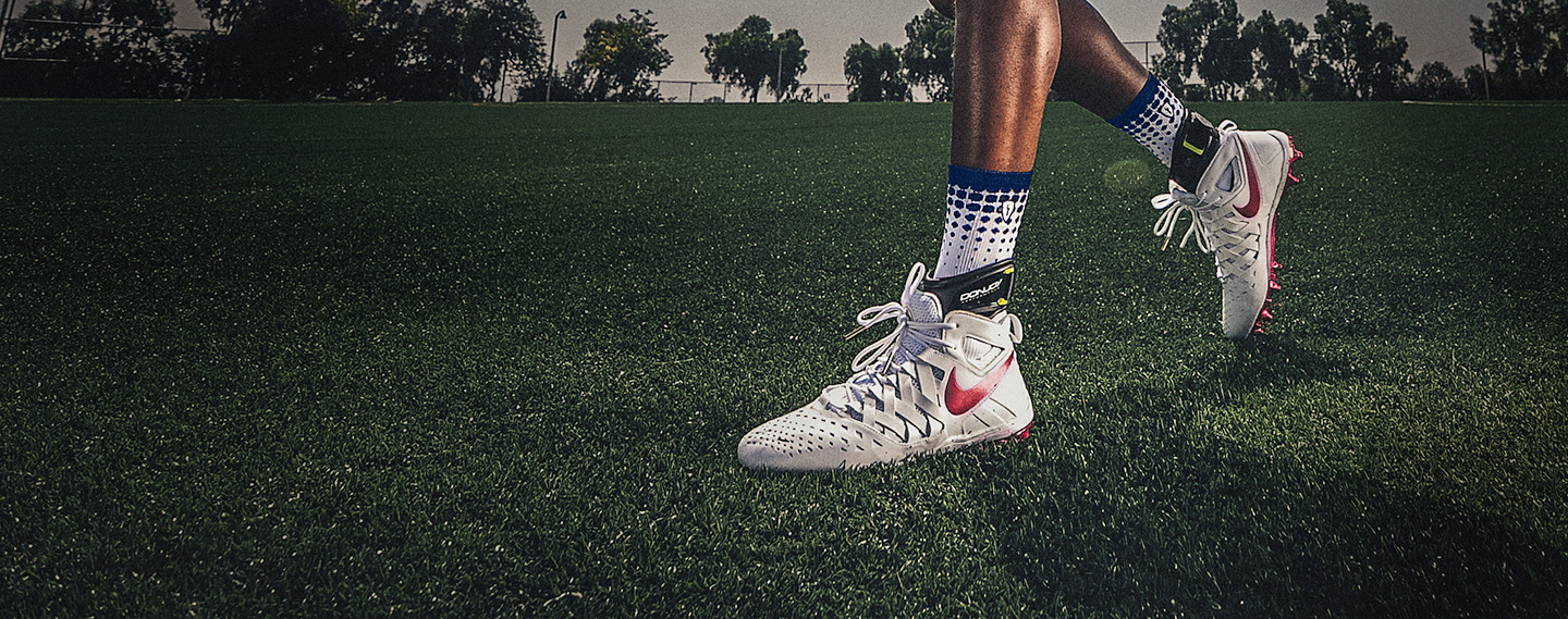 Athlete on a field wearing the DonJoy Performance POD ankle brace