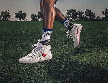 Athlete on a field wearing the DonJoy Performance POD ankle brace