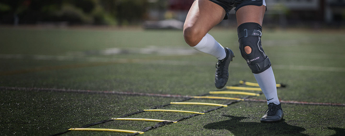 DonJoy Performance Bionic™ Drytex Hinged Knee Sleeve
 worn by and female athlete doing the ladder drill